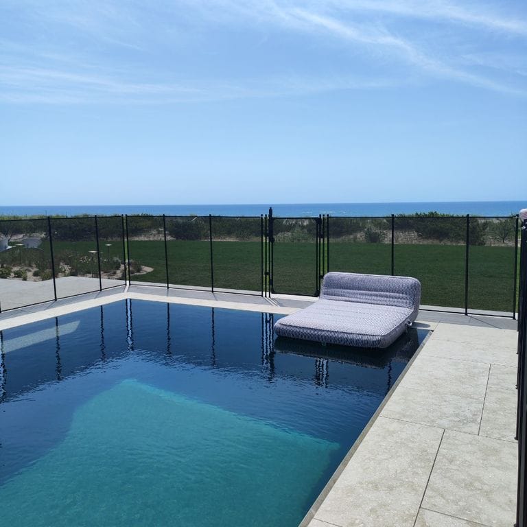 Application image for Veneto Olivo Limestone - Pool Coping. The image shows this product being used for pool coping and pool deck pavers. The surface finish shown is sand blasted. The dominant color shown is gray.