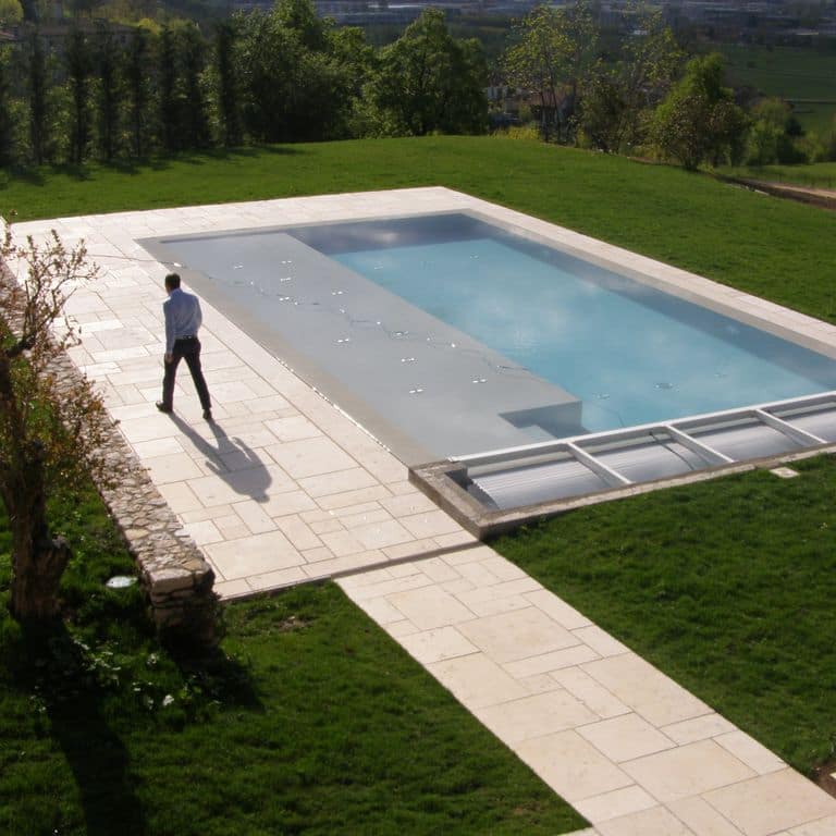 Application image for Veneto Beige Limestone - Pool Coping. The image shows this product being used for pool coping and pool deck pavers. The surface finish shown is sand blasted. Dominant colors shown are beige, tan and cream. The color mix creates a warm feeling.