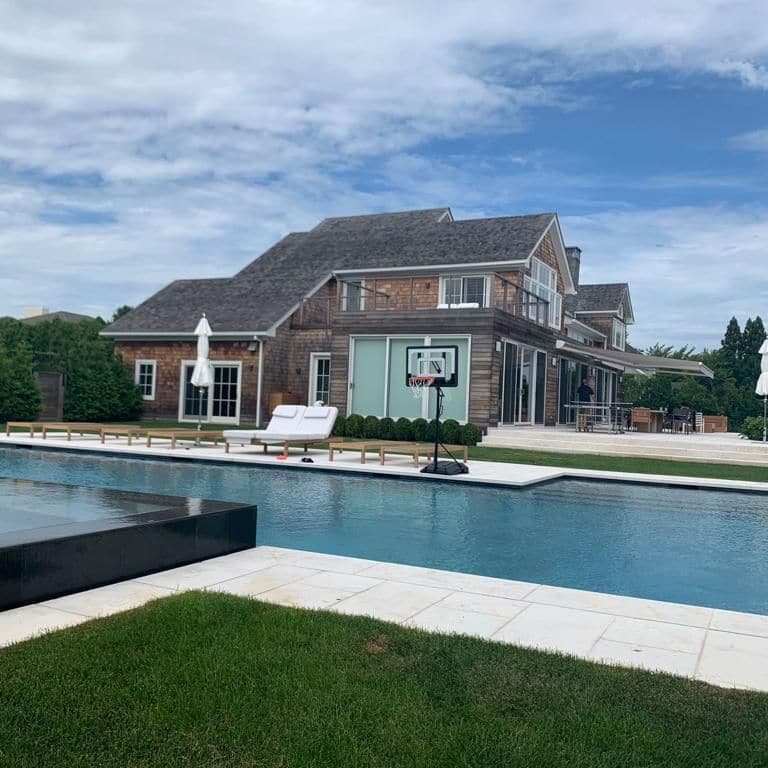 Application image for Veneto Beige Limestone - Pool Coping. The image shows this product being used for pool coping and pool deck pavers. The surface finish shown is flamed. Dominant colors shown are beige, tan and cream; with a white secondary. The color mix creates a cool feeling. Regular color pattern.