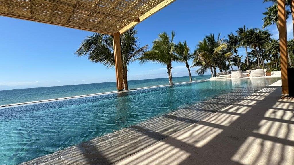 Application image for Veneto Beige Limestone - Pool Coping. The image shows this product being used for pool coping and pool deck pavers. The surface finish shown is sand blasted. Dominant colors shown are beige, tan and cream. The color mix creates a warm feeling.